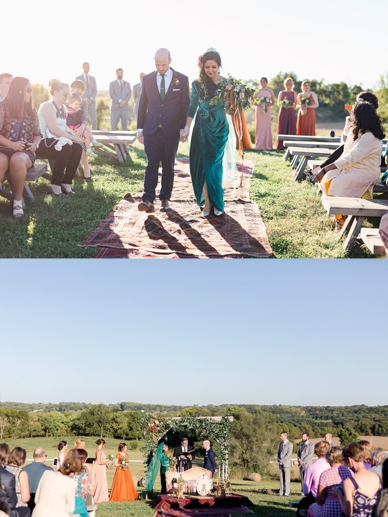 Bride in green dress walking down the aisle over rugs for an outdoor ceremony in North Dakota. 