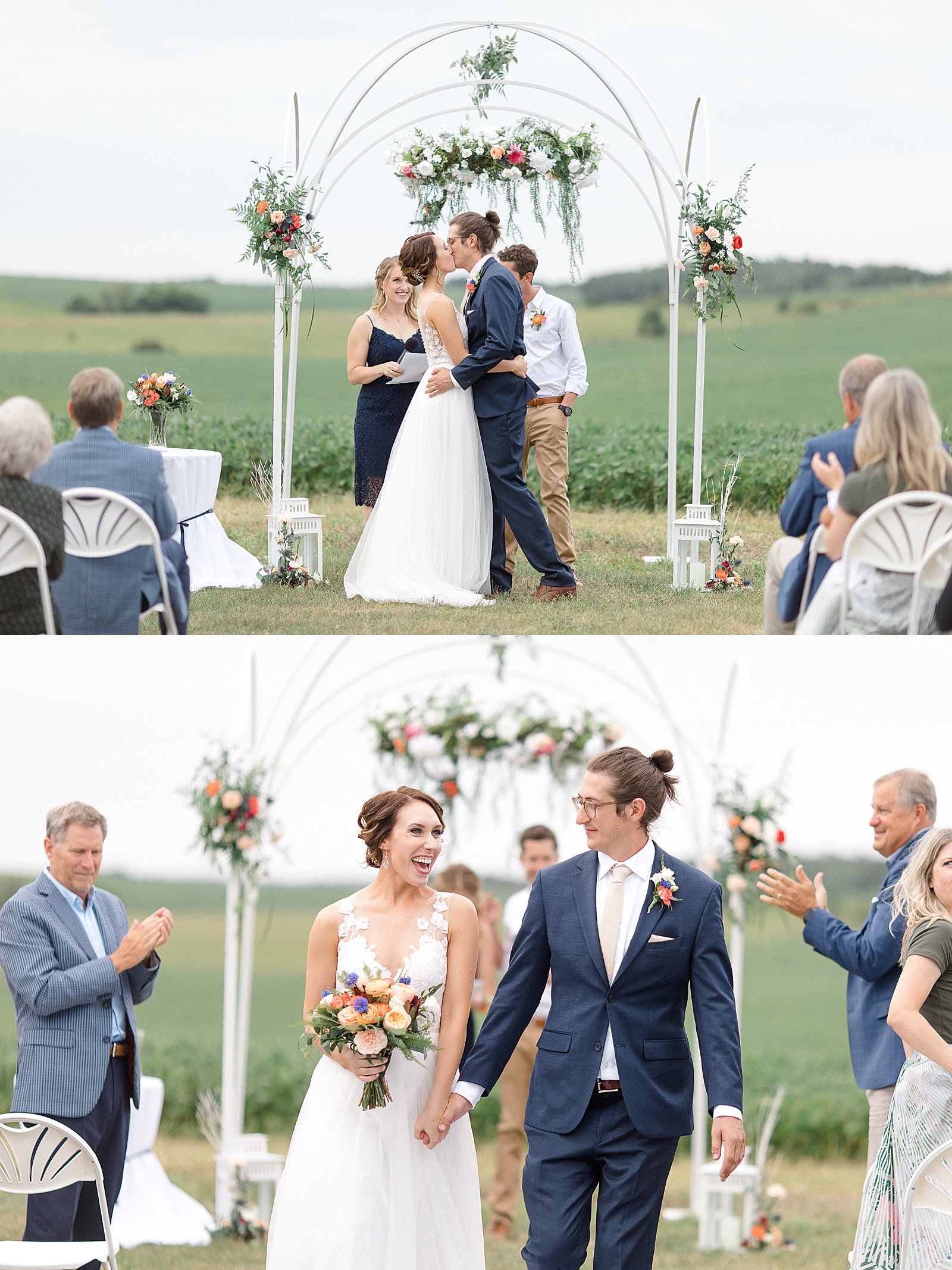 Newlyweds sharing a kiss at their arch alter with bright flowers overhead 