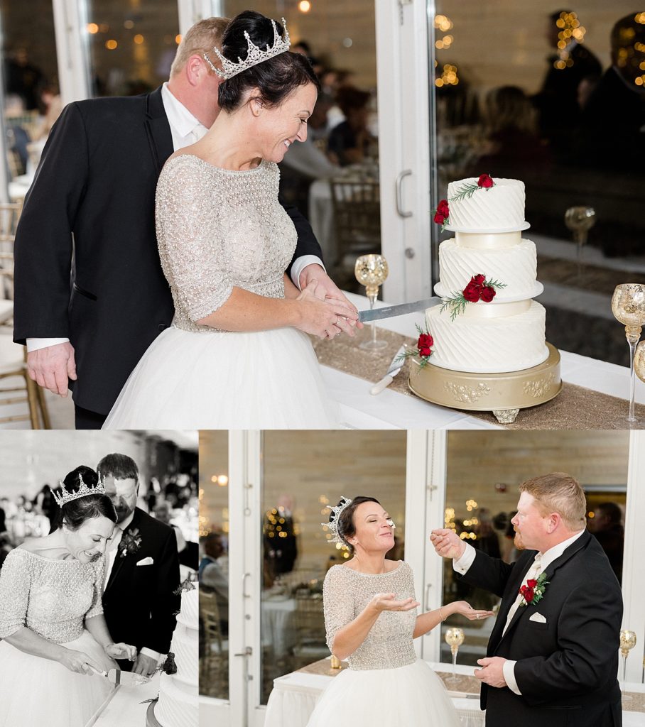Newlyweds cutting their white three tiered cake at reception 