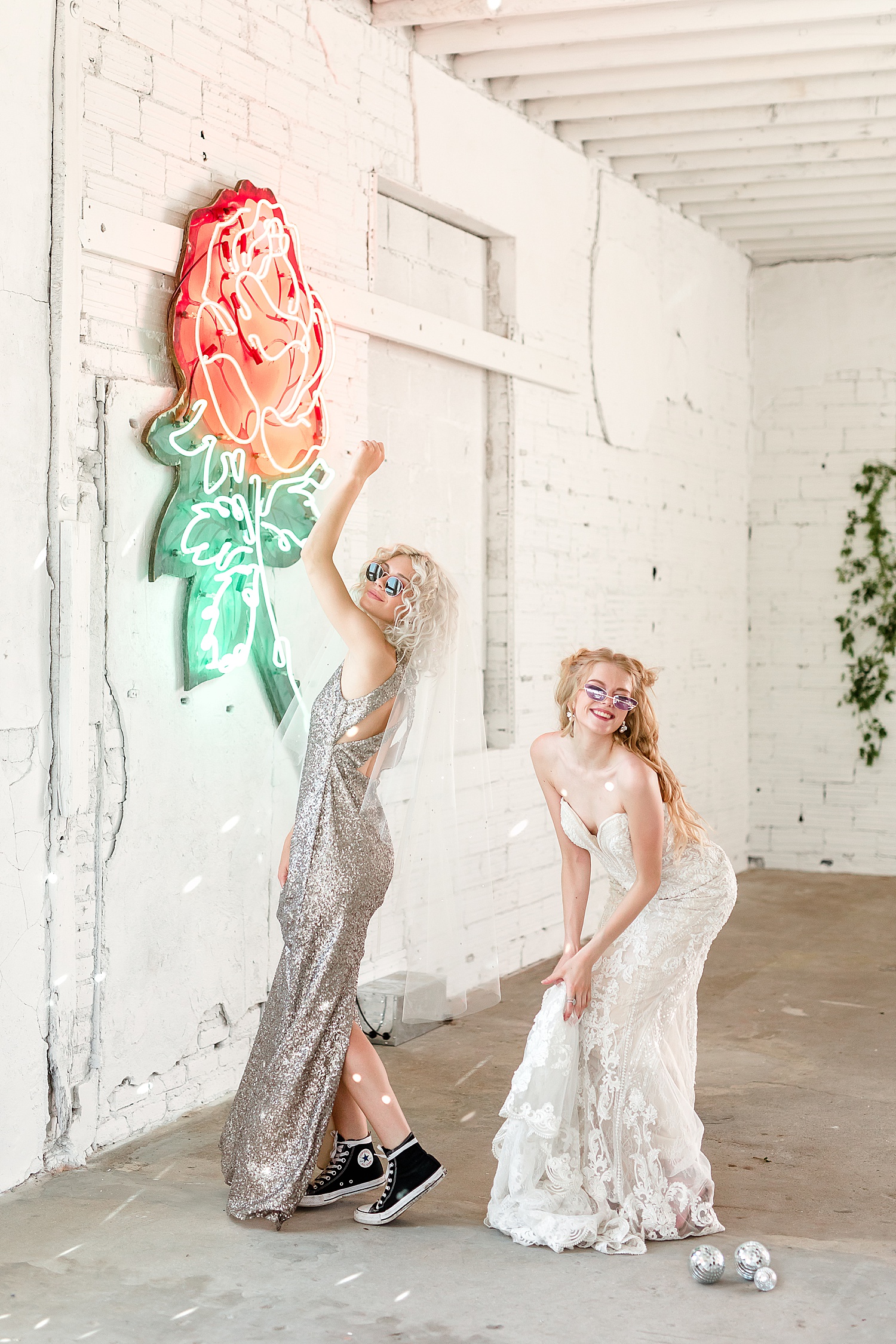 bride and bridesmaid dancing at ivy and rose warehouse in North Dakota 