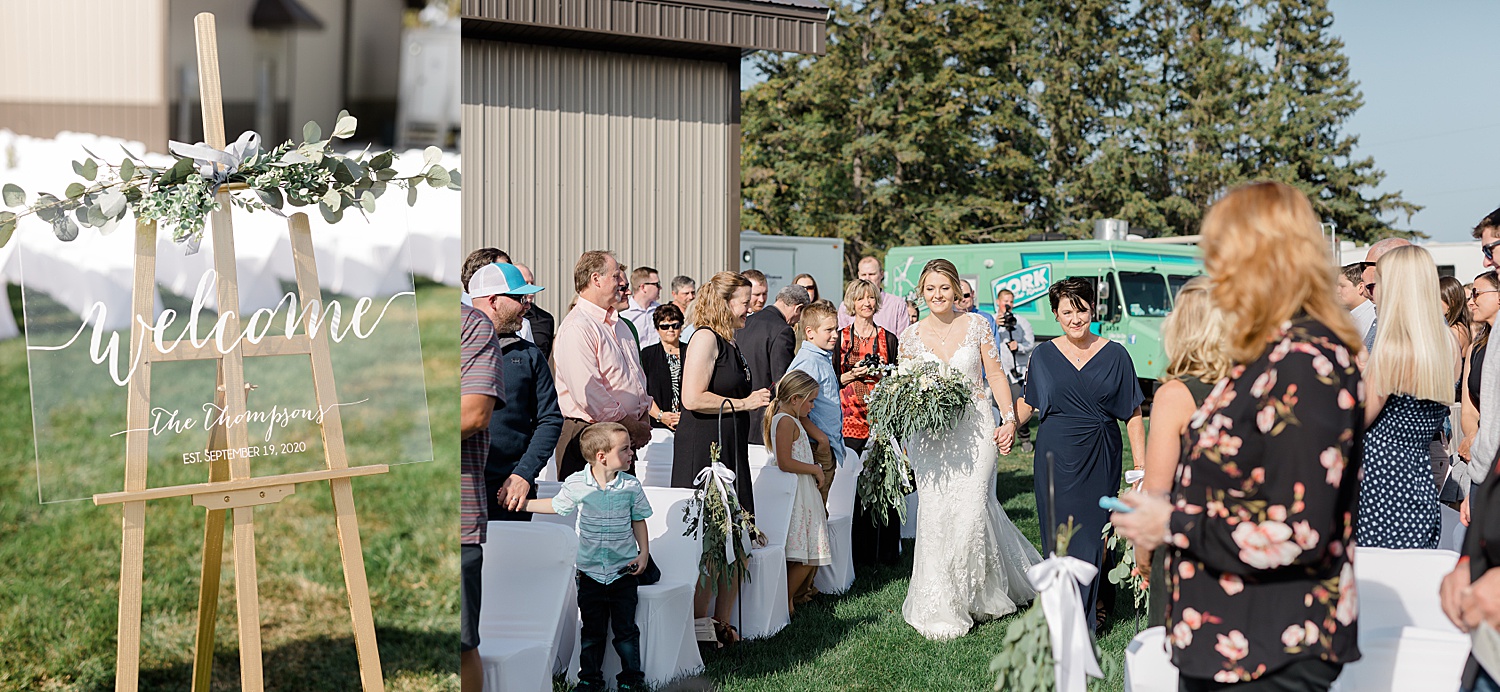 mother of bride walks daughter down the aisle during wedding ceremony