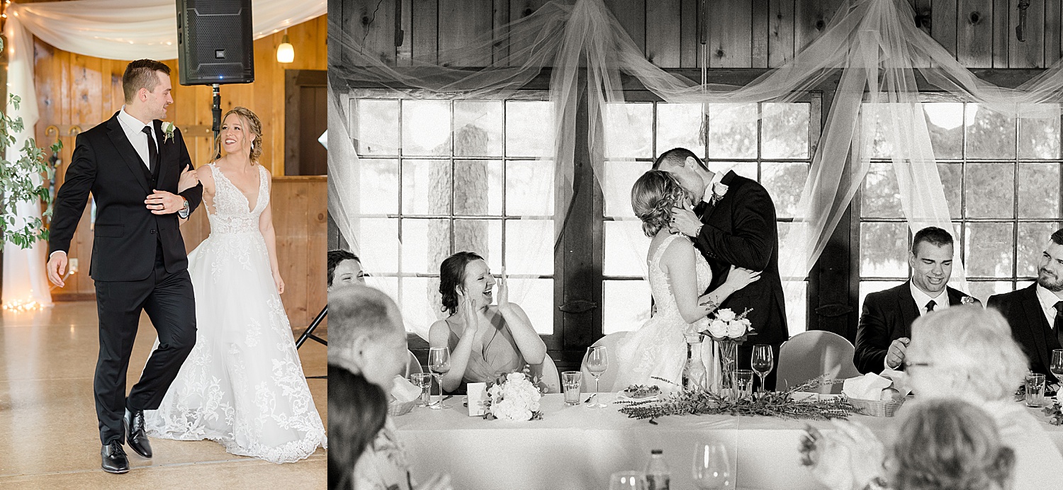 bride and groom kiss at reception table after making grand entrance 
